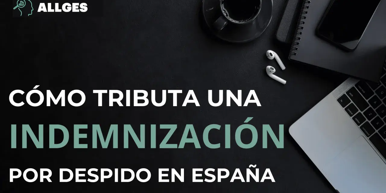 Cómo tributa una indemnización por despido improcedente en España. Imagen de escritorio con portátil, móvil y café.