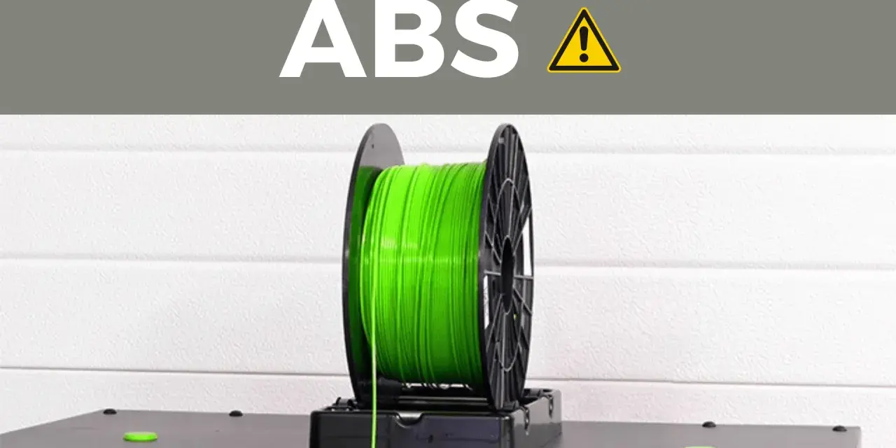 A spool of bright green ABS plastic filament, commonly used for 3D printing durable parts.
