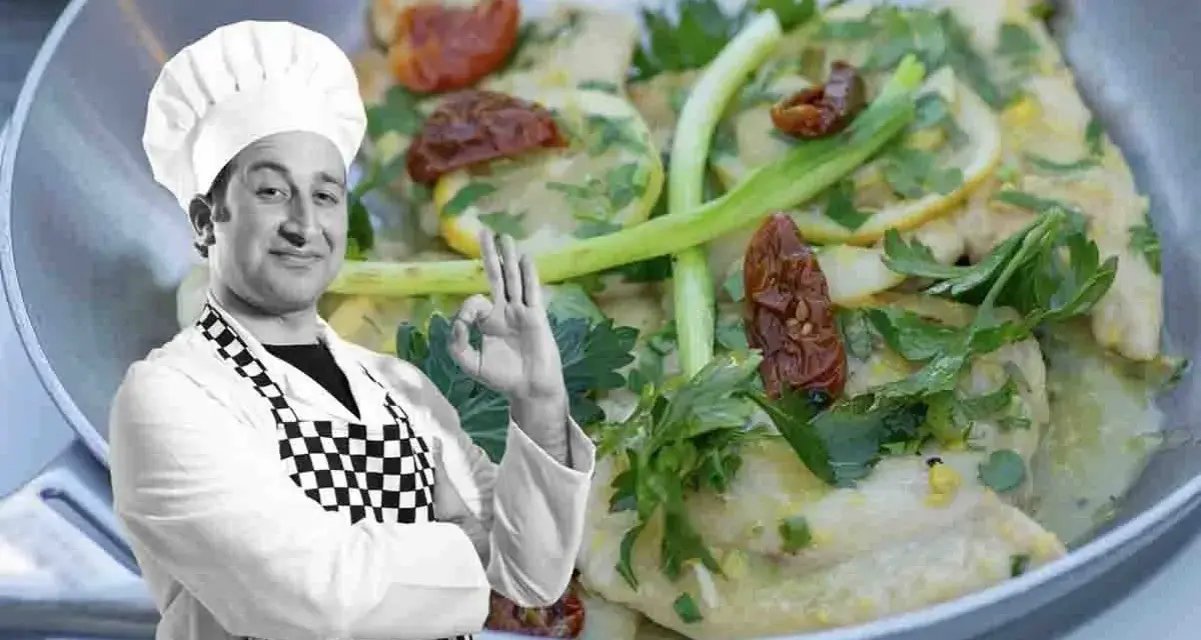 Chef approva scaloppine al limone cremose, un piatto invitante con limone, pomodori secchi e prezzemolo.
