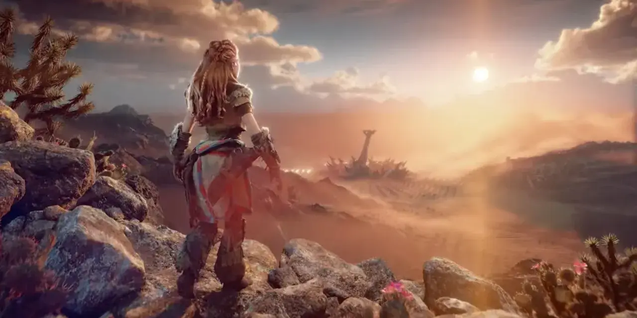 Aloy contempla un paisaje desértico al atardecer en Horizon Forbidden West, con ruinas mecánicas a lo lejos.