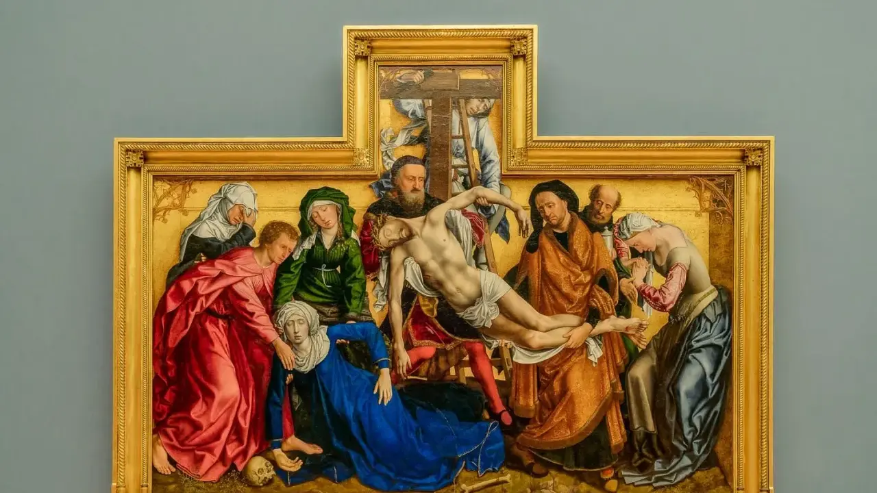 A dramatic religious painting, likely from a museum, depicts the descent from the cross with figures in rich robes surrounding a fallen Christ.