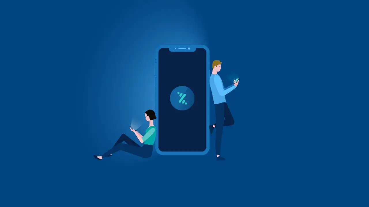 Dos personas usan sus móviles junto a un gran smartphone. Explica qué es Bizum y cómo funciona, una forma fácil de enviar dinero.