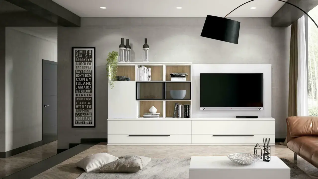Estantería blanca moderna con TV, ideal como inspiración de colores para salones pequeños.