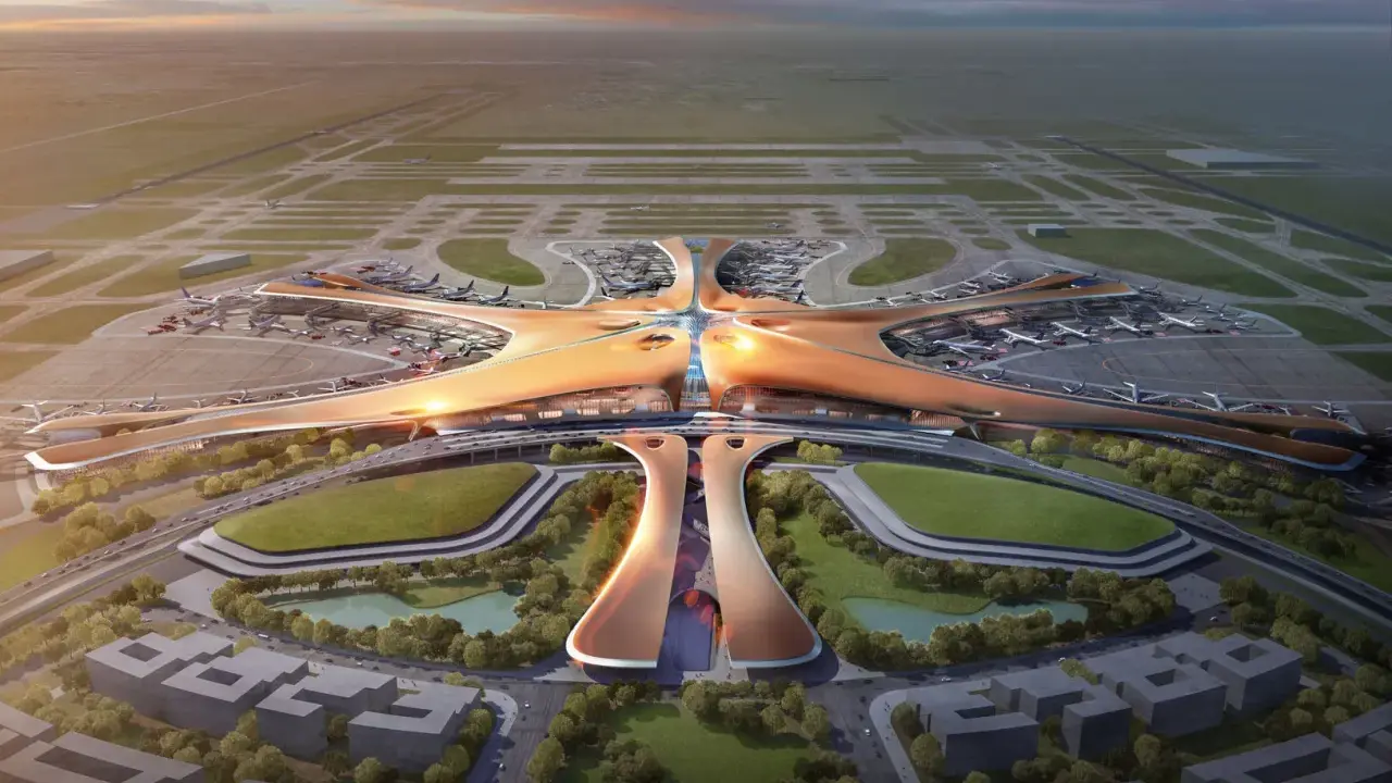 Futurystyczny terminal lotniczy, przypominający rozgwiazdę, z licznymi samolotami na płycie. To wizja największego lotniska na świecie.
