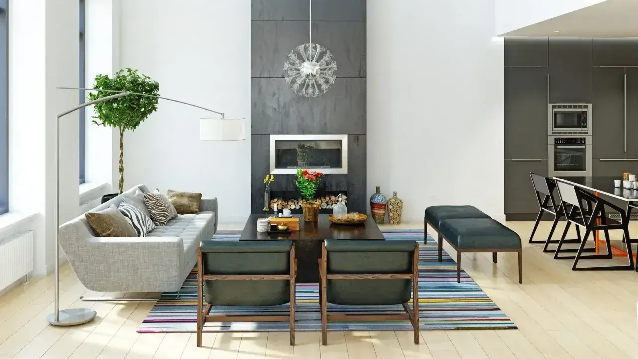 Nowoczesne wnętrza: szara sofa, kominek, designerskie fotele i kuchnia. Różne style wnętrz w jednym, przestronnym salonie.