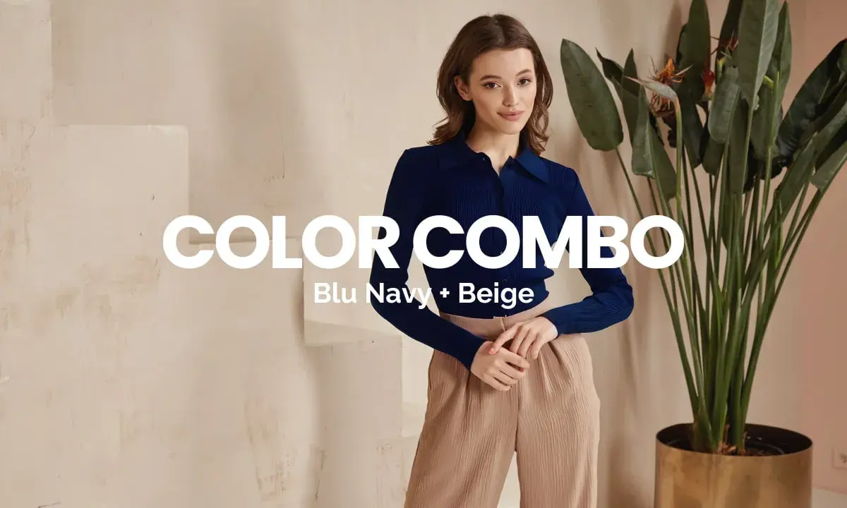 Modello con maglia blu navy e pantaloni beige. Il color combo beige e azzurro stanno bene insieme, creando un look elegante.