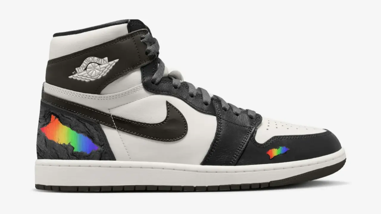 Der erste Air Jordan High mit Regenbogen-Akzenten, die wie ein Riss in der schwarzen Oberfläche wirken.