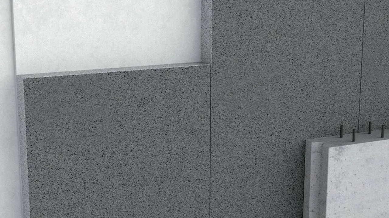 Detalle de un muro con hormigón aislante térmico, mostrando capas y textura granular.