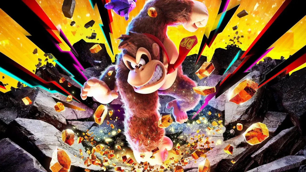 Donkey Kong w akcji, otoczony przez spadające skały i błyszczące kryształy, z kolorowymi promieniami w tle.