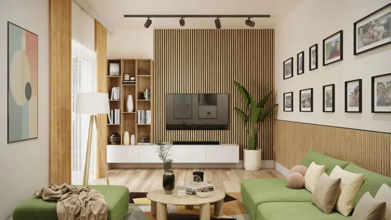 Nowoczesny salon z zieloną kanapą i stolikiem kawowym. Ściana za telewizorem ozdobiona jest pionowymi lamelami, które nadają wnętrzu ciepła i elegancji.