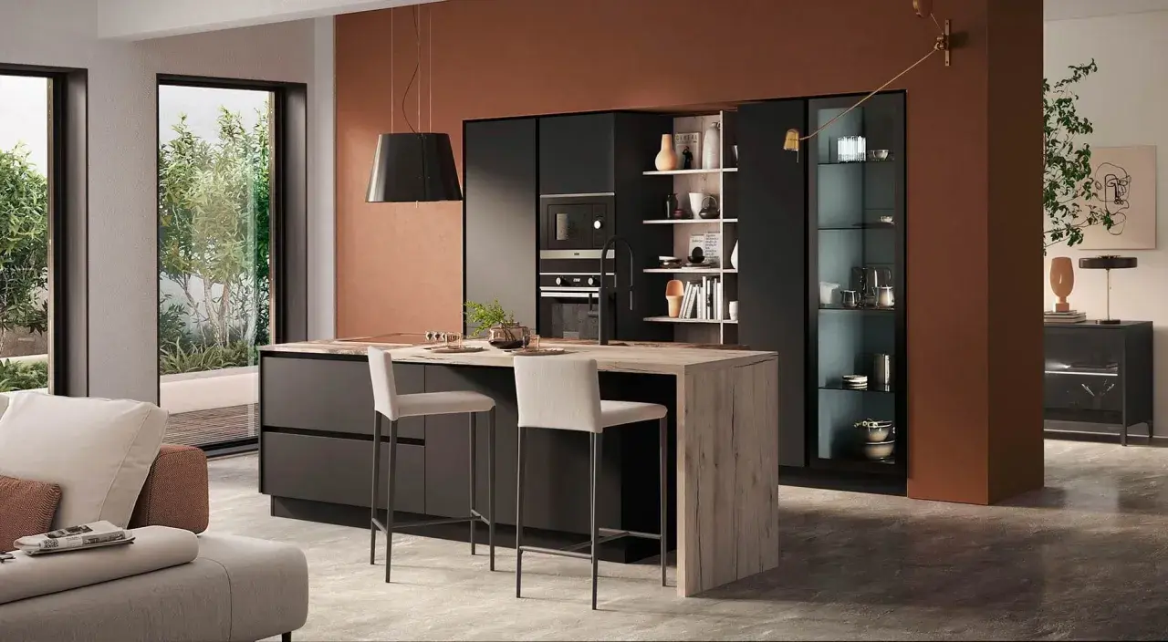 Elegante zona giorno open space con cucina moderna, isola centrale in legno e soggiorno accogliente.