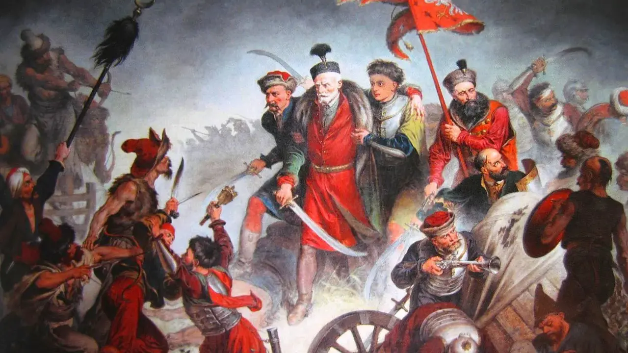 Obraz przedstawia zaciętą bitwę pod Kłuszynem 1610. Polscy żołnierze walczą z wrogiem, wznosząc sztandar z orłem.