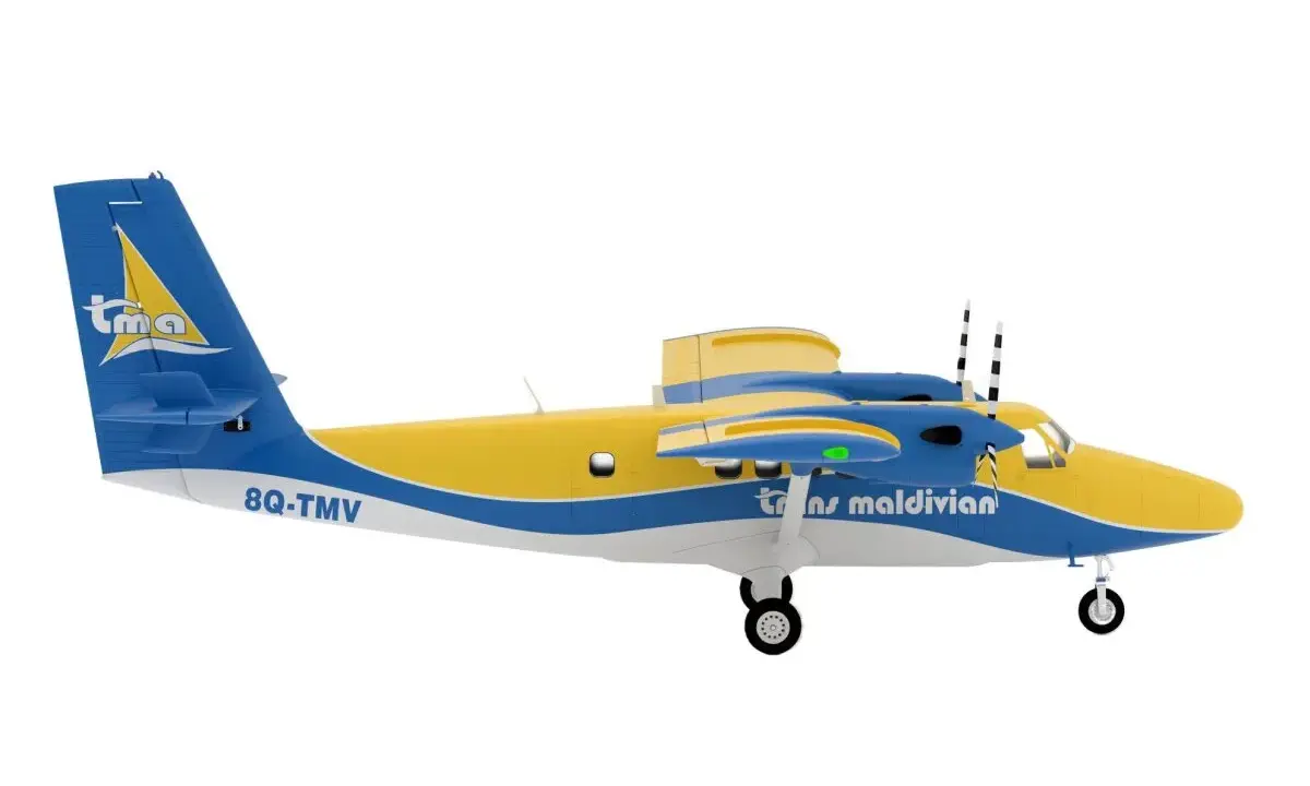 Ein gelb-blaues Twin Otter Flugzeug der Trans Maldivian Airways mit der Kennung 8Q-TMV hebt ab.