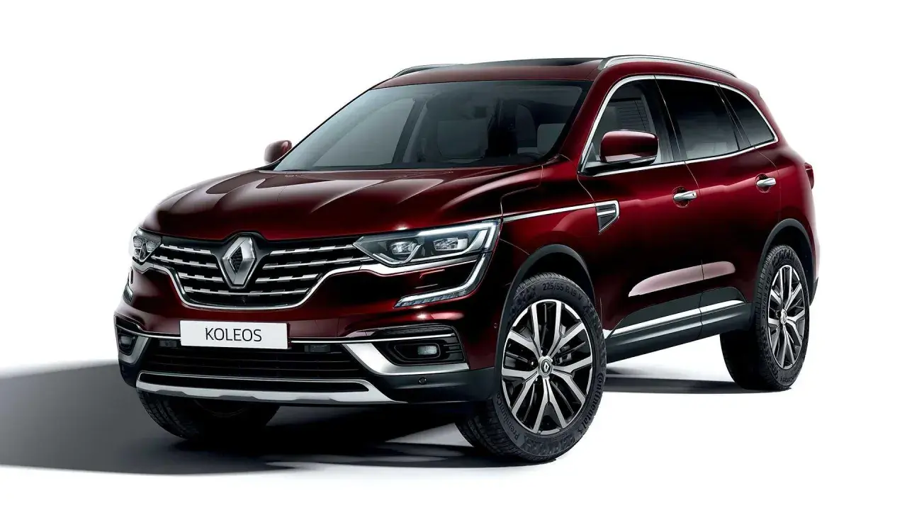 Elegancki, bordowy Renault Koleos 2.0 dCi z chromowanymi detalami i felgami 19 cali, gotowy na każdą podróż.