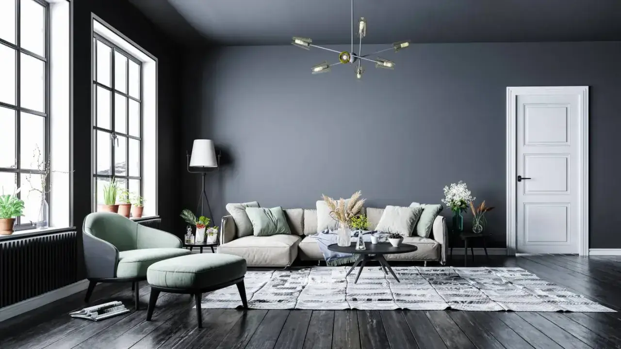 Nowoczesny salon z szarą ścianą, beżową kanapą i miętowym fotelem. Inspiracje kolory dla Twojego wnętrza.