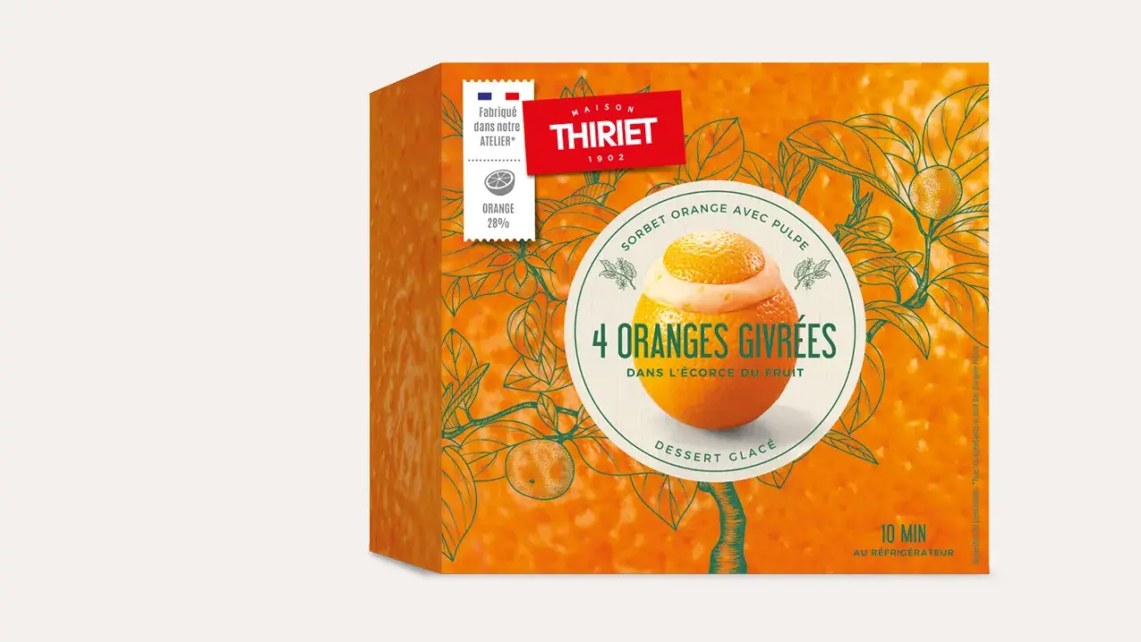 Boîte de sorbet "4 Oranges Givrées" de Maison Thiriet, avec une illustration d'orange garnie de sorbet dans son écorce.