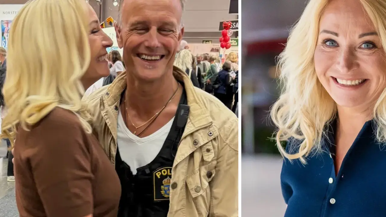 Martina Haag och hennes partner ler glatt. Han bär en väst med polisbricka.