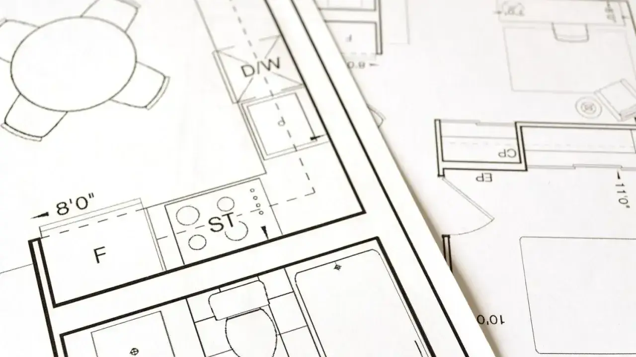 Plany architektoniczne pokazują, jak obliczyć metry kwadratowe pokoju, z zaznaczonymi wymiarami i elementami wyposażenia.