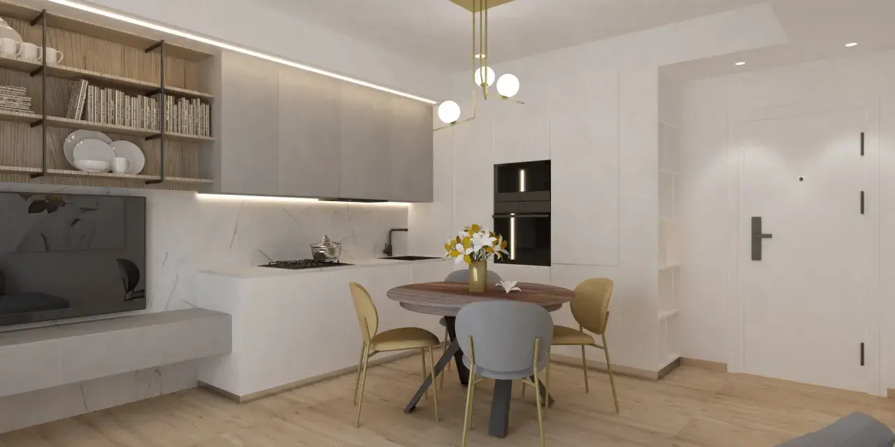Ingresso su sala da pranzo con tavolo rotondo, sedie, cucina moderna e scaffali a muro.