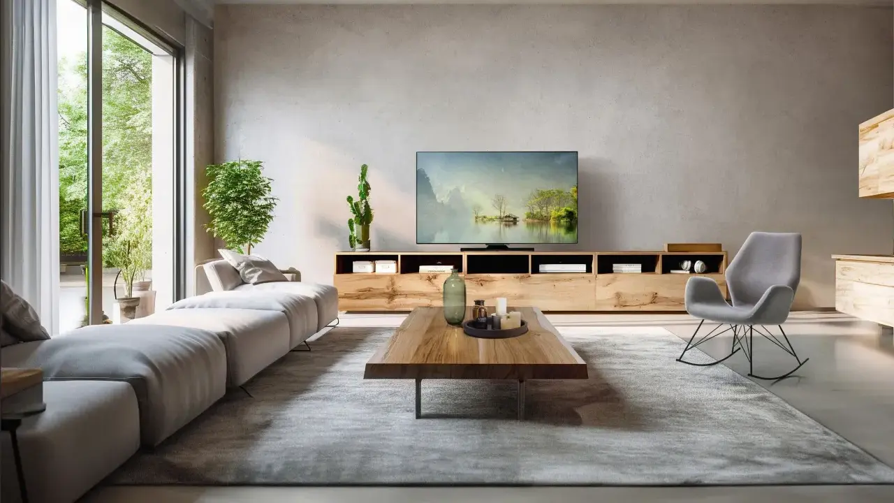 Modernes Wohnzimmer mit großem Sofa, TV-Möbel und Schaukelstuhl. Tolle kabel verstecken ideen für ein aufgeräumtes Ambiente.