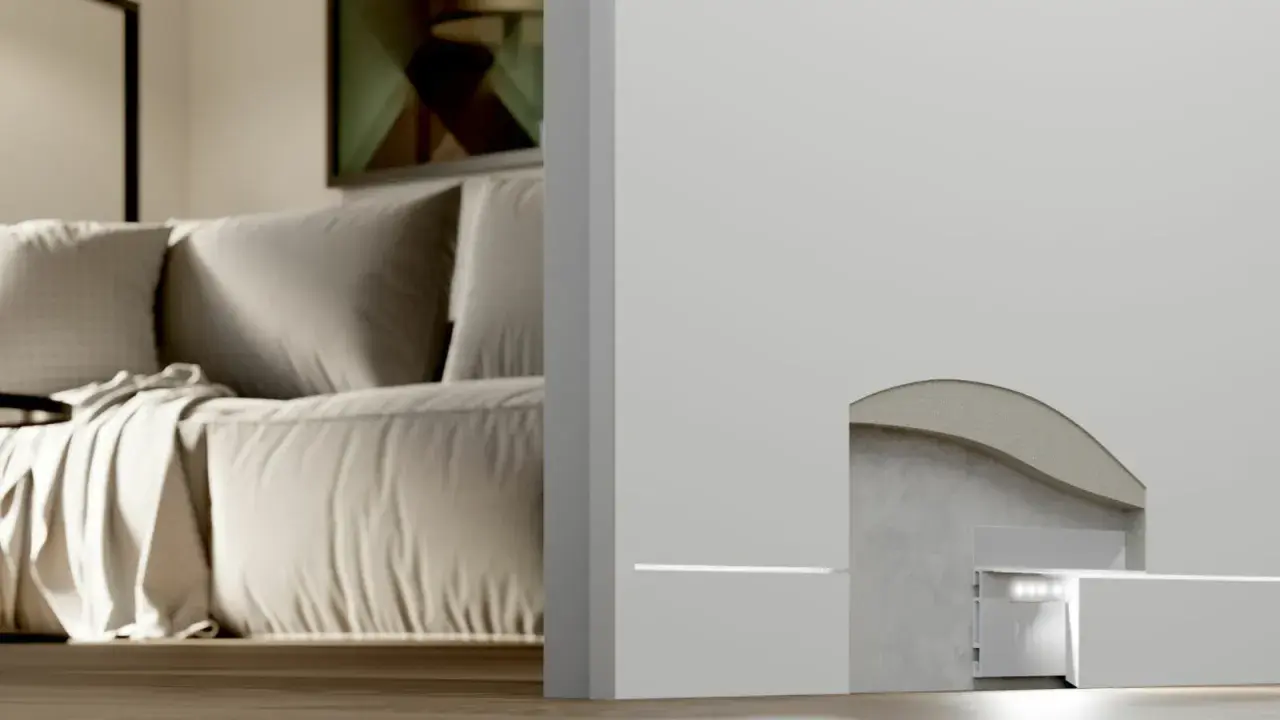 Dettaglio tecnico di un battiscopa filo muro con illuminazione integrata. Analisi pro e contro per un design moderno.