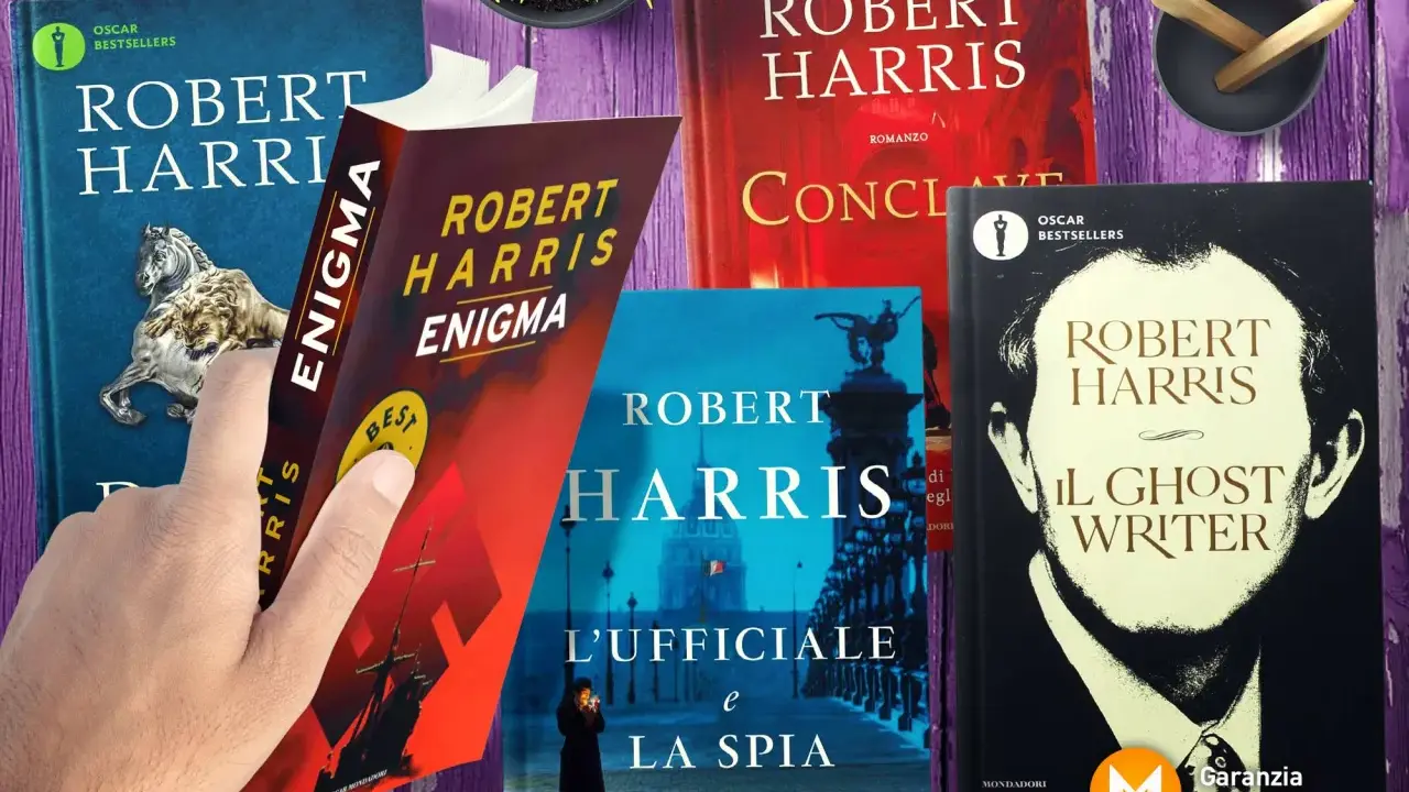 Mani che sfogliano libri di Robert Harris: "Enigma", "L'Ufficiale e la Spia", "Il Ghost Writer" e altri titoli.