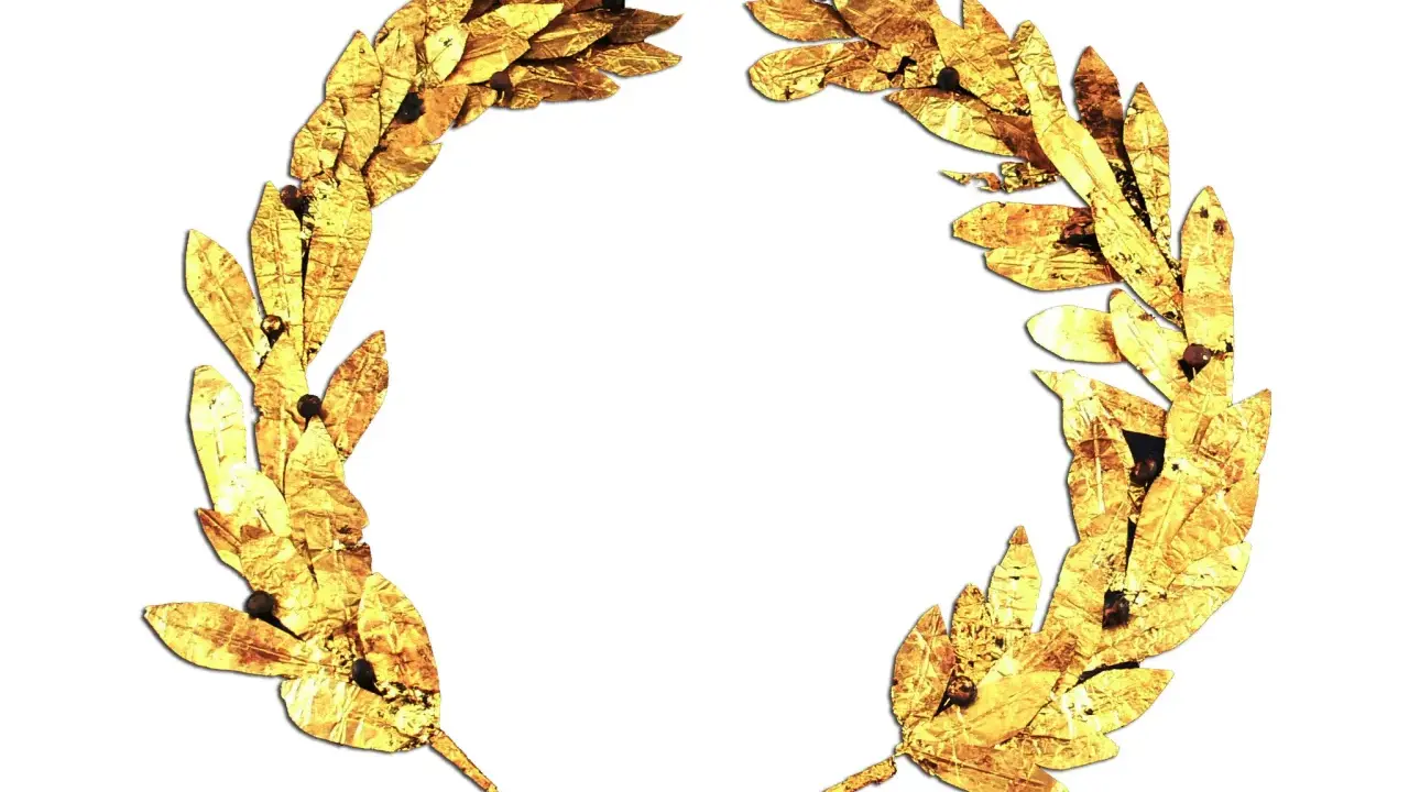 Złoty wieniec laurowy, symbol wiecznej chwały. Nawet gdy wszystko inne przeminie, pamięć o zwycięstwie pozostanie. Nie wszystek umrę.