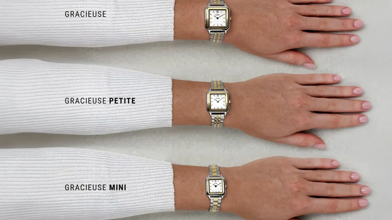Tre orologi da polso con quadrante bianco e lunetta in oro e argento, indossati da tre braccia.