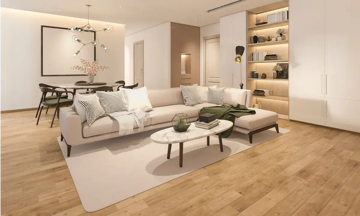 Nowoczesny salon z beżową kanapą, stolikiem kawowym i otwartymi półkami. Po prawej stronie znajduje się **niewidoczna szafa w salonie**, która wtapia się w ścianę.
