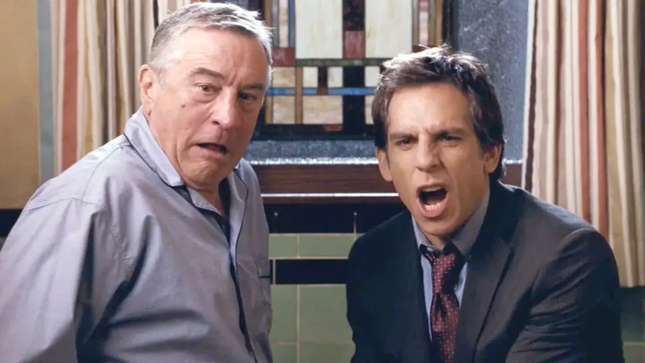 Robert De Niro och Ben Stiller i en komisk scen. Deras ansiktsuttryck antyder en intensiv diskussion, typiskt för filmer med Ben Stiller.