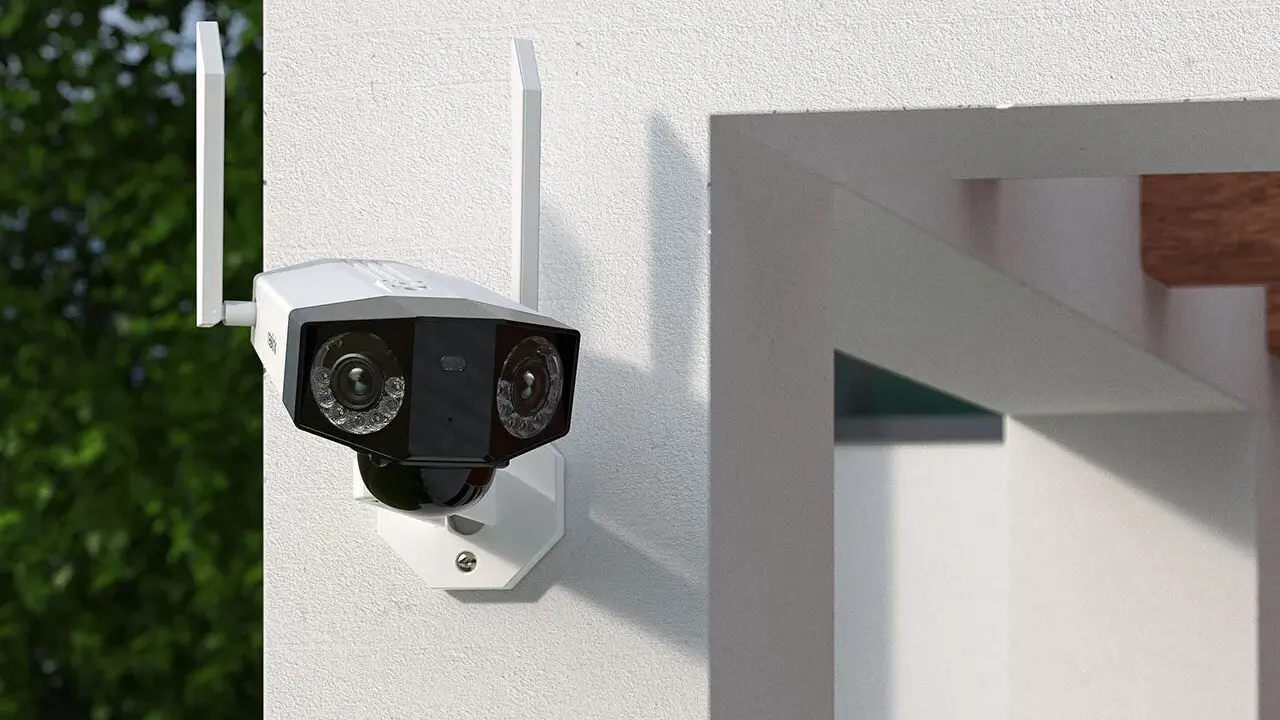 Kamera monitoringu z dwoma obiektywami zamontowana na białej ścianie.