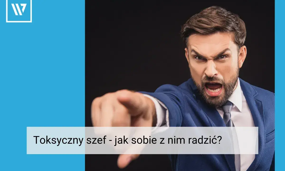 Wściekły mężczyzna w garniturze wskazuje palcem, ukazując cechy toksycznego szefa.