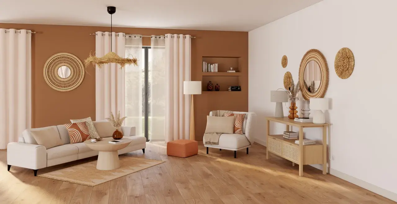 Un salon **cocooning salon bois et blanc** avec canapé, fauteuil, table basse et console. Décoration murale en rotin et coussins aux motifs géométriques.
