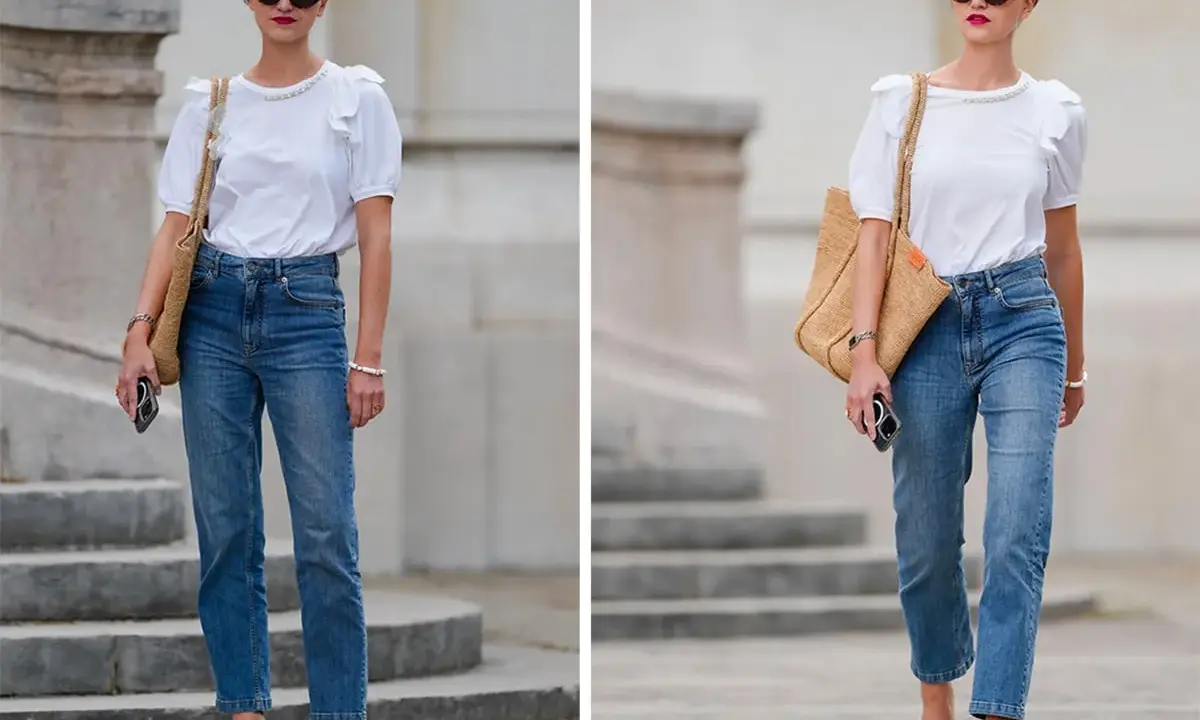 Donna con outfit jeans e maglietta bianca, borsa di paglia e occhiali da sole.