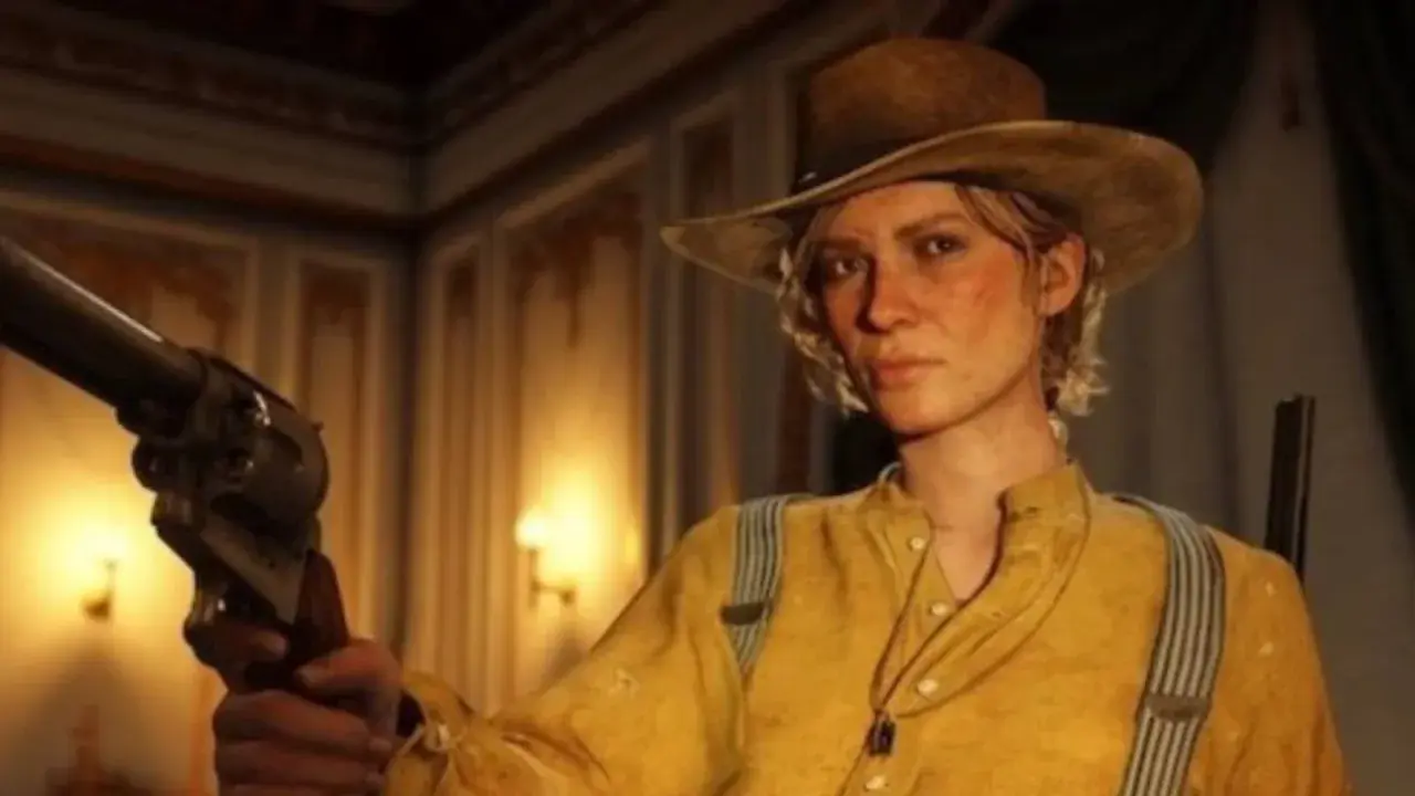 Sadie Adler w kapeluszu i żółtej koszuli trzyma rewolwer, gotowa do akcji.