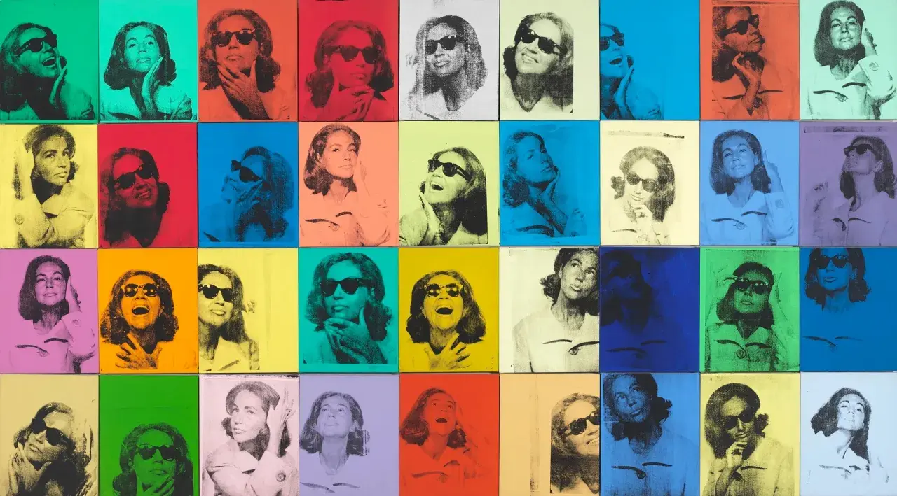 Andy Warhol pop art painting featuring a woman in sunglasses repeated in a grid of vibrant, contrasting colors.