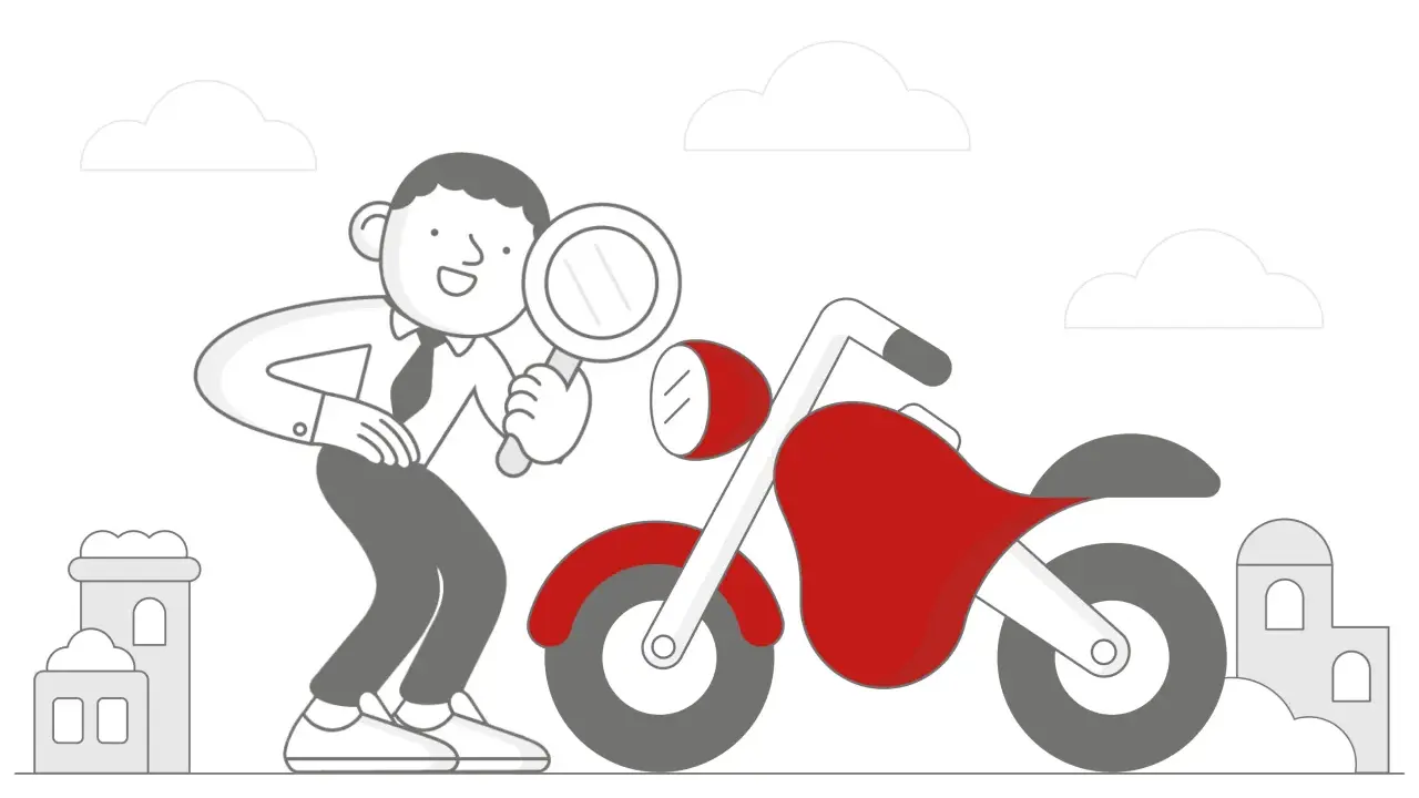 Mężczyzna z lupą dokonuje przeglądu motocykla.