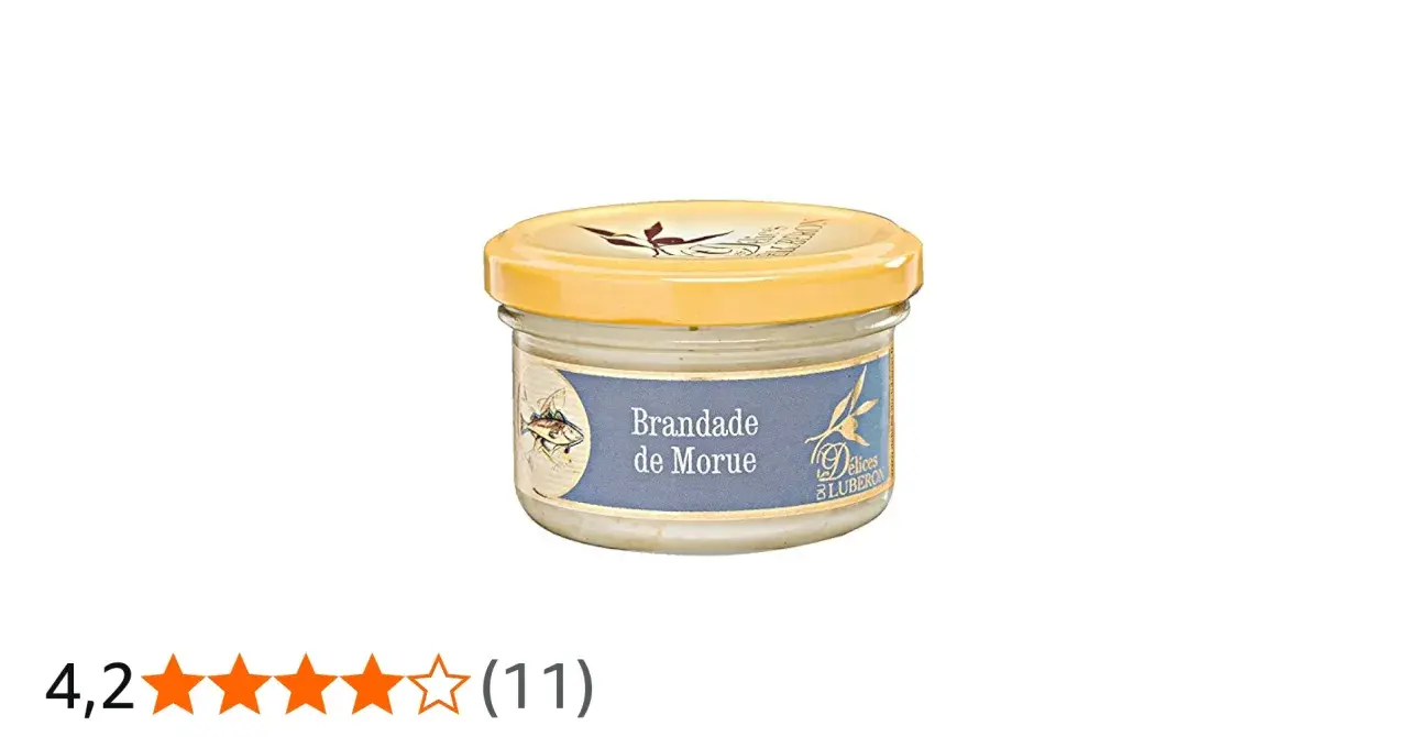 Glas mit Brandade de Morue, einer cremigen Kabeljaupaste, mit einem Fischmotiv auf dem Etikett.