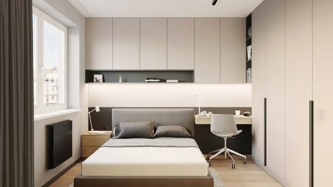 Dormitorio moderno con cama, escritorio y armarios empotrados. Ideas de almacenamiento de dormitorio para maximizar el espacio.