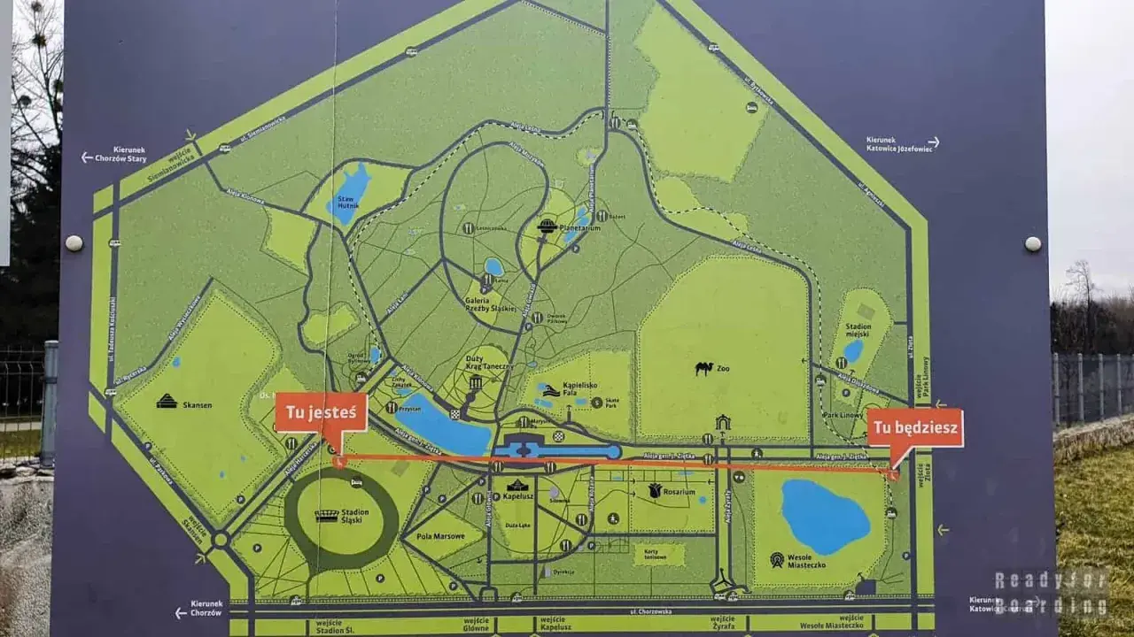 Mapa Parku Śląskiego z zaznaczonymi atrakcjami: Zoo, Planetarium, Stadion Śląski, Rosarium, Wesołe Miasteczko. Tu jesteś i Tu będziesz wskazują drogę.