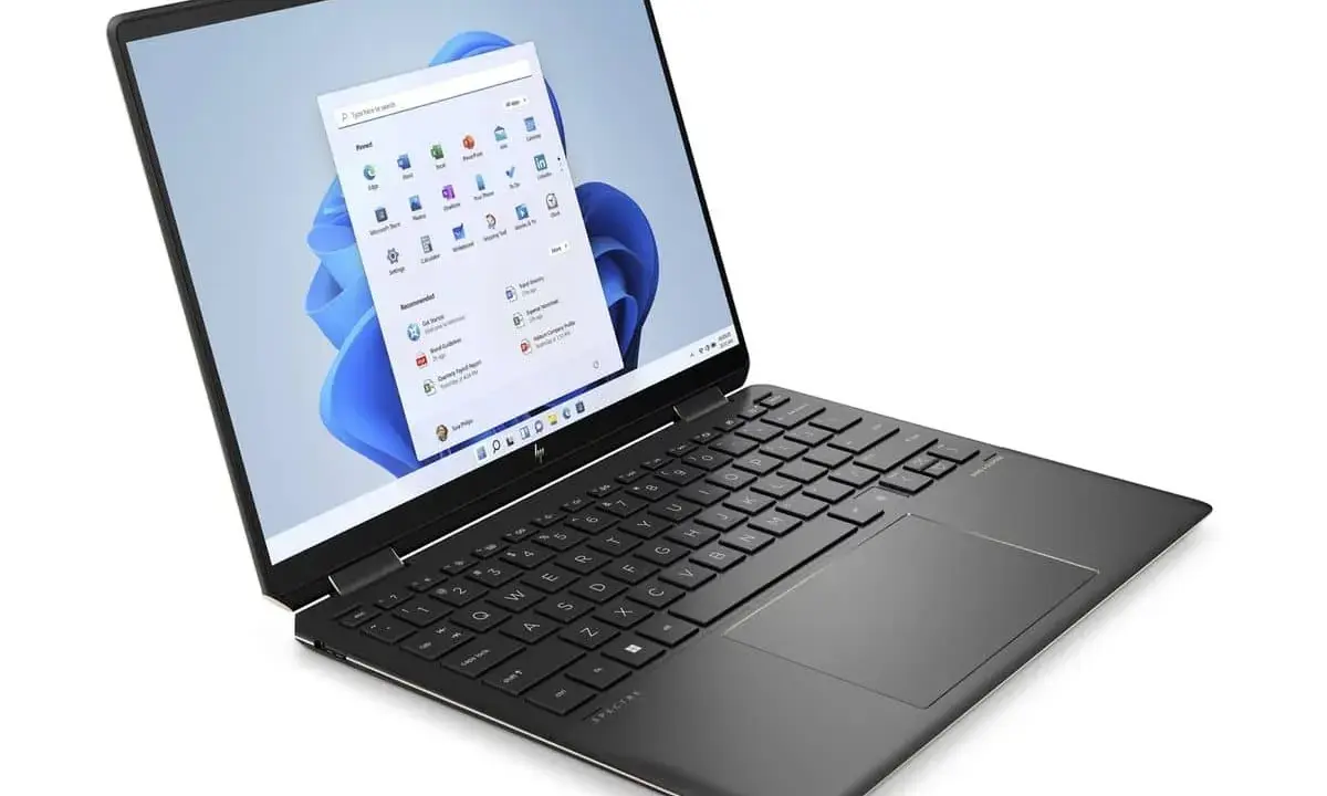 Ordinateur portable HP Spectre, idéal pour une configuration PC pour Photoshop et Lightroom. Son écran affiche Windows 11.