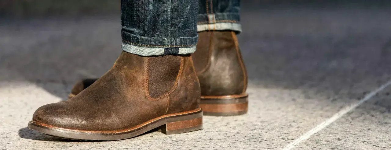 These rugged brown leather chelsea boots, paired with cuffed denim, prove that chelsea boots are in style and perfect for a casual yet sharp look.