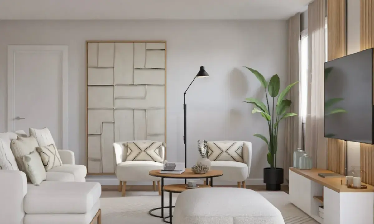 Salón moderno con sofá y sillones blancos, mesa de centro, planta y TV. Ideas para como decorar un salón con muebles blancos.