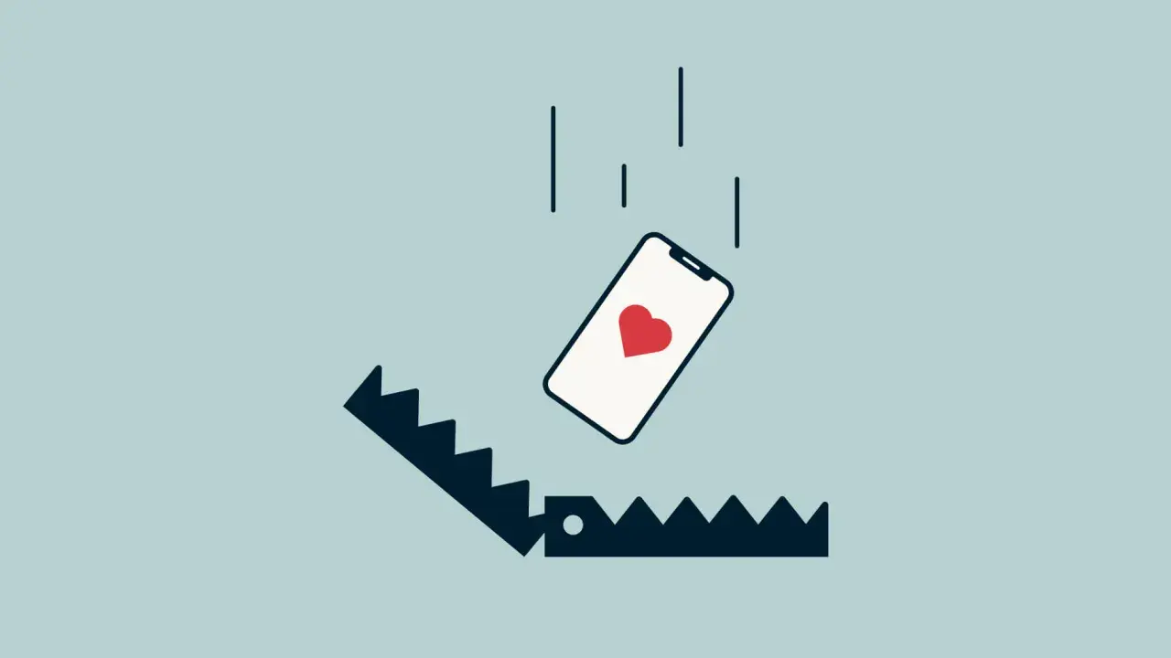 Telefon z sercem spada w pułapkę. Ilustracja symbolizuje rzeczy, o których kłamiemy na portalach randkowych, by zwabić ofiarę.