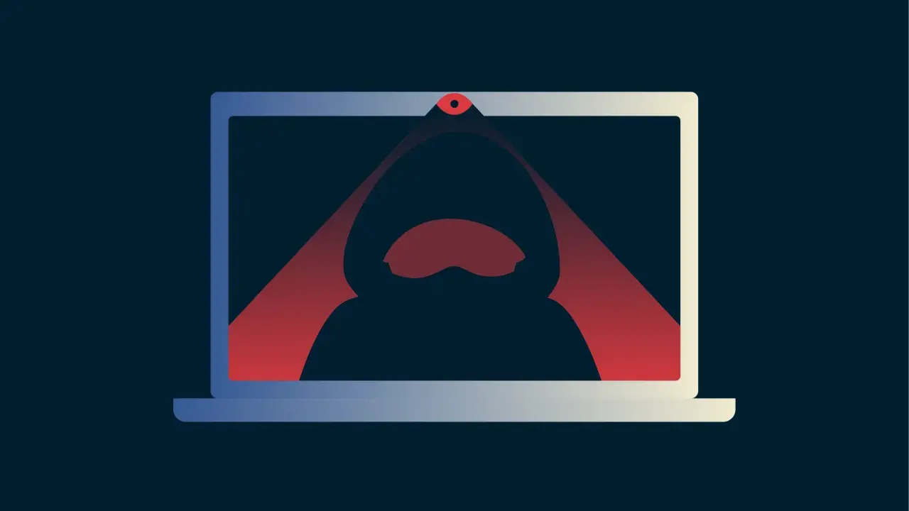 Ein Laptop mit einer roten Linse, die einen Hacker im Kapuzenpullover im Inneren beleuchtet. Das Bild symbolisiert das **webcam hacken**.