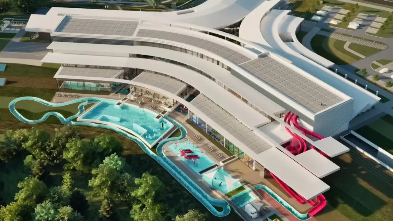 Nowoczesny aquapark Rzeszów z basenami, zjeżdżalniami i strefą relaksu, otoczony zielenią.