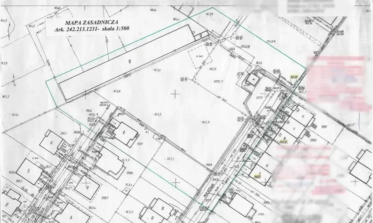 Mapa zasadnicza do warunków zabudowy z zaznaczonymi działkami, budynkami i infrastrukturą. Skala 1:500.