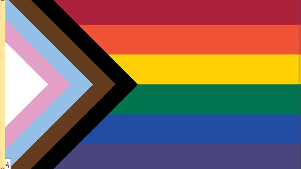 Progress Pride flag with stripes of red, orange, yellow, green, blue, and purple, plus a chevron of white, pink, light blue, brown, and black. This symbolizes inclusivity, suggesting Belize is gay friendly.