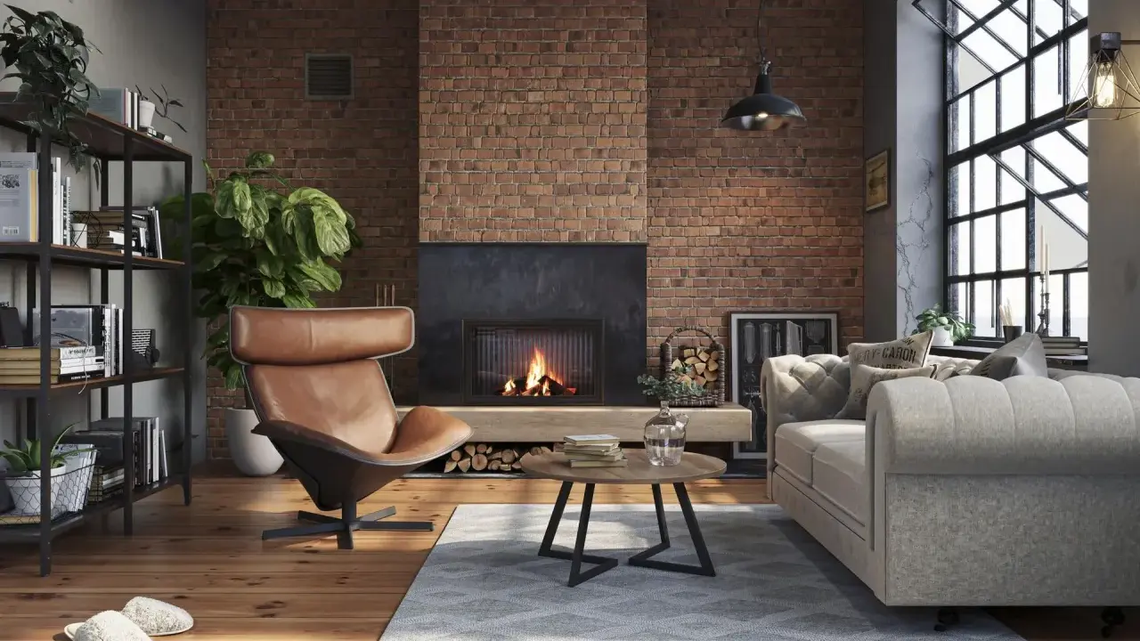 Przytulny salon w stylu loft. Ceglana ściana, kominek, skórzany fotel i wygodna kanapa – idealne salon loft inspiracje.