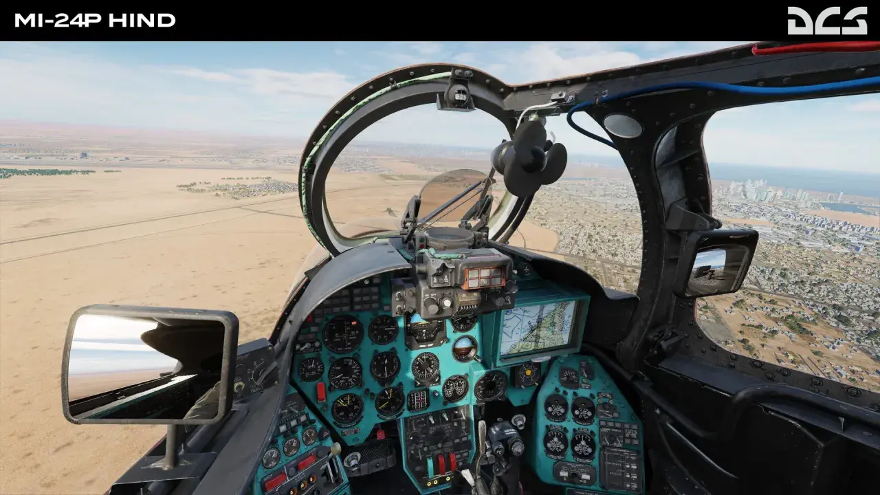 Widok z kokpitu Mi-24P Hind w DCS World Steam Edition. Lądujemy w pobliżu miasta nad pustynią.